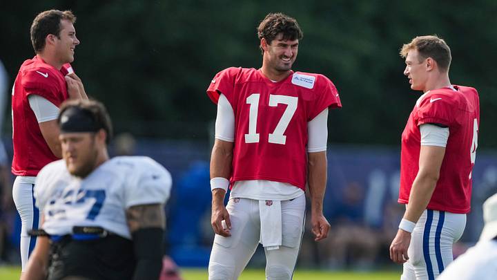 Indianapolis Colts quarterback Daniel Jones (17) smiles with talking to Indianapolis Colts quarterback Easton Stick (4) and Indianapolis Colts quarterback Riley Leonard (15) on Sunday, Aug. 9, 2026, during Colts Camp practice at Gand Park in Westfield. Indianapolis Colts quarterback Daniel Jones (17) smiles with talking to Indianapolis Colts quarterback Easton Stick (4) and Indianapolis Colts quarterback Riley Leonard (15) on Sunday, Aug. 9, 2026, during Colts Camp practice at Gand Park in Westfield.