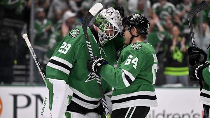 May 13, 2025; Dallas, Texas, USA; Dallas Stars goaltender Jake Oettinger (29) and center Mikael Granlund (64) celebrate the win over the Winnipeg Jets in game four of the second round of the 2025 Stanley Cup Playoffs at American Airlines Center. Mandatory Credit: Jerome Miron-Imagn Images