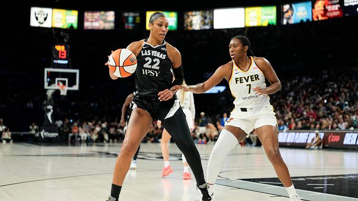 Sep 27, 2026; Las Vegas, Nevada, USA; Las Vegas Aces center A'ja Wilson (22) dribbles the ball against Indiana Fever center-forward Aliyah Boston (7) during the first quarter of game one of the first round for the 2026 WNBA Playoffs at Michelob Ultra Arena. Mandatory Credit: Lucas Peltier-Imagn Images Sep 27, 2026; Las Vegas, Nevada, USA; Las Vegas Aces center A'ja Wilson (22) dribbles the ball against Indiana Fever center-forward Aliyah Boston (7) during the first quarter of game one of the first round for the 2026 WNBA Playoffs at Michelob Ultra Arena. Mandatory Credit: Lucas Peltier-Imagn Images
