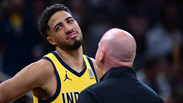 Oct 27, 2024; Indianapolis, Indiana, USA; Indiana Pacers guard Tyrese Haliburton (0) talks to a staff member during the second half against the Philadelphia 76ers at Gainbridge Fieldhouse. Mandatory Credit: Marc Lebryk-Imagn Images