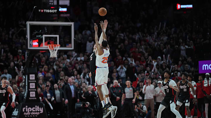 Mar 12, 2025; Portland, Oregon, USA; New York Knicks small forward Mikal Bridges (25) shoots the game-winning basket over Portland Trail Blazers center Donovan Clingan (23) during overtime at Moda Center. Mandatory Credit: Soobum Im-Imagn Images