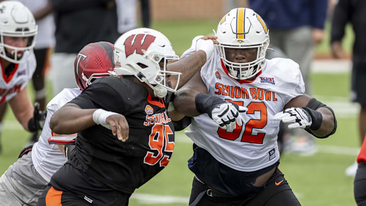 The Wisconsin Badgers regularly have players participate in college football all-star games ahead of the NFL Draft, like former defensive lineman Keeanu Benton (95) at the Senior Bowl.