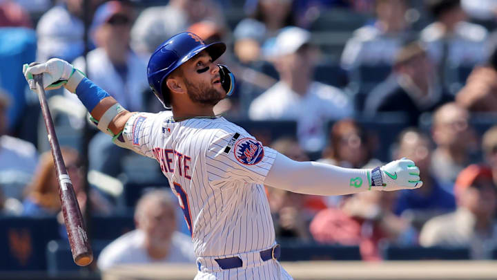 Mar 26, 2026; New York City, New York, USA; New York Mets third baseman Bo Bichette (19) follows through on an RBI sacrifice fly against the Pittsburgh Pirates during the first inning at Citi Field. Mandatory Credit: Brad Penner-Imagn Images