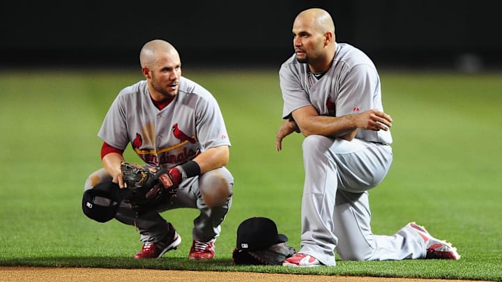 Apr. 19, 2010; Phoenix, AZ, USA; St. Louis Cardinals first baseman Albert Pujols (right) talks with second baseman Skip Schumaker against the Arizona Diamondbacks at Chase Field. The Cardinals defeated the Diamondbacks 4-2. Mandatory Credit: Mark J. Rebilas-Imagn Images