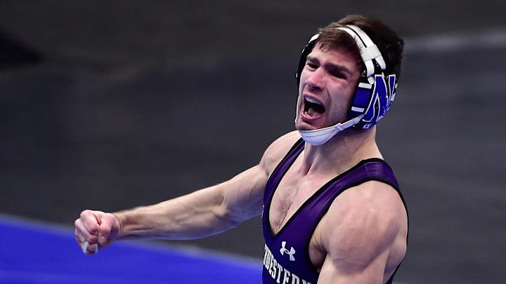 Mar 18, 2021; St. Louis, Missouri, USA;  Northwestern Wildcats wrestler Chris Cannon celebrates after defeating Arizona State Sun Devils wrestler Michael McGee during the NCAA Division I Wrestling Championships at Enterprise Center. Mandatory Credit: Jeff Curry-Imagn Images