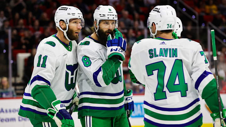 Carolina Hurricanes players wearing the franchise's Hartford Whalers throwback uniforms.