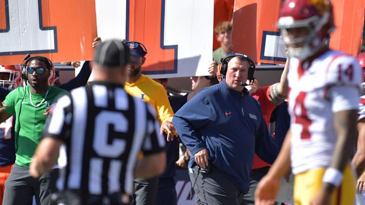 Sep 27, 2025; Champaign, Illinois, USA;  Illinois Fighting Illini head coach Bret Bielema looks on as Southern California Trojans quarterback Jayden Maiava (14) talks with an official during the first half at Memorial Stadium. Mandatory Credit: Ron Johnson-Imagn Images