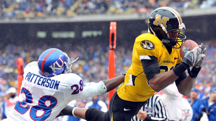Nov 29, 2008; Kansas City, MO, USA; Missouri Tigers wide receiver Danario Alexander (81) makes the catch as Kansas Jayhawks cornerback Daymond Patterson is in coverage in the second half at Arrowhead Stadium. Nov 29, 2008; Kansas City, MO, USA; Missouri Tigers wide receiver Danario Alexander (81) makes the catch as Kansas Jayhawks cornerback Daymond Patterson is in coverage in the second half at Arrowhead Stadium.