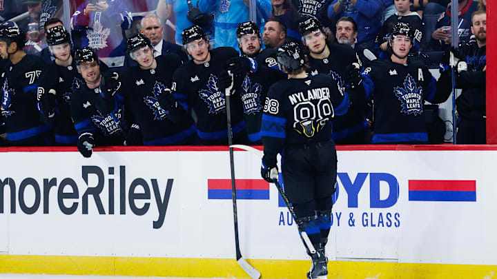 Oct 28, 2024; Winnipeg, Manitoba, CAN; Toronto Maple Leafs forward William Nylander (88) celebrates with teammates after scoring a goal against the Winnipeg Jets during the first period at Canada Life Centre. Mandatory Credit: Terrence Lee-Imagn Images
