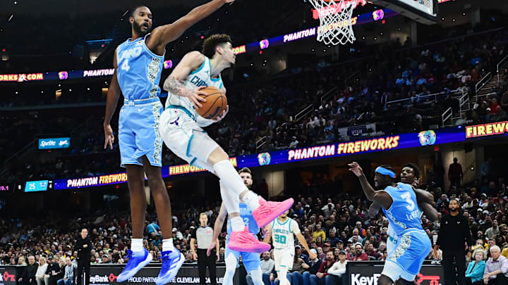 Nov 17, 2024; Cleveland, Ohio, USA; Charlotte Hornets guard LaMelo Ball (1) drives to the basket against Cleveland Cavaliers forward Evan Mobley (4) during the first half at Rocket Mortgage FieldHouse. Mandatory Credit: Ken Blaze-Imagn Images Nov 17, 2024; Cleveland, Ohio, USA; Charlotte Hornets guard LaMelo Ball (1) drives to the basket against Cleveland Cavaliers forward Evan Mobley (4) during the first half at Rocket Mortgage FieldHouse. Mandatory Credit: Ken Blaze-Imagn Images
