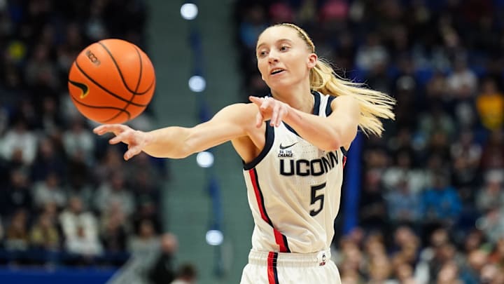 Dec 15, 2024; Storrs, Connecticut, USA; UConn Huskies guard Paige Bueckers (5) passes the ball against the Georgetown Hoyas in the first half at XL Center. Mandatory Credit: David Butler II-Imagn Images