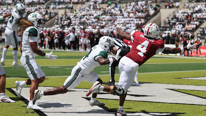 Aug 23, 2025; Honolulu, Hawaii, USA; While being guarded by Hawaii Rainbow Warriors defensive back Elijah Palmer (4), Stanford Cardinal wide receiver Jordan Onovughe (4) can’t pull in and end zone catch during the first half of an NCAA college football game at Clarence T.C. Ching Athletics Complex. Mandatory Credit: Marco Garcia-Imagn Images Aug 23, 2025; Honolulu, Hawaii, USA; While being guarded by Hawaii Rainbow Warriors defensive back Elijah Palmer (4), Stanford Cardinal wide receiver Jordan Onovughe (4) can’t pull in and end zone catch during the first half of an NCAA college football game at Clarence T.C. Ching Athletics Complex. Mandatory Credit: Marco Garcia-Imagn Images