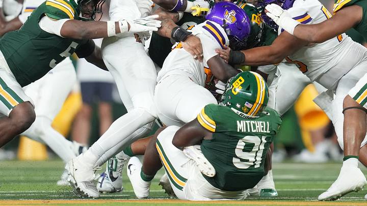 Sep 12, 2026; Waco, Texas, USA; Prairie View A&M Panthers running back KyYon Harris (26) is tackled by Baylor Bears defensive lineman Traevon Mitchell (91) during the first half at McLane Stadium. Mandatory Credit: Chris Jones-Imagn Images Sep 12, 2026; Waco, Texas, USA; Prairie View A&M Panthers running back KyYon Harris (26) is tackled by Baylor Bears defensive lineman Traevon Mitchell (91) during the first half at McLane Stadium. Mandatory Credit: Chris Jones-Imagn Images