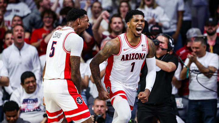 Arizona Wildcats guard KJ Lewis (5) celebrates with Arizona Wildcats guard Caleb Love (1) during the Wildcats' thrilling overtime win against Iowa State. Arizona Wildcats guard KJ Lewis (5) celebrates with Arizona Wildcats guard Caleb Love (1) during the Wildcats' thrilling overtime win against Iowa State.