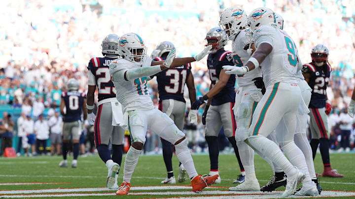 Miami Dolphins wide receiver Jaylen Waddle (17) celebrates his touchdown against the New England Patriots with teammates on the field during the second half at Hard Rock Stadium last season.