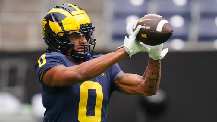 Jan 6, 2024; Houston, TX, USA; Michigan Wolverines wide receiver Darrius Clemons (0) catches the ball during a practice session before the College Football Playoff national championship game against the Washington Huskies at NRG Stadium. Mandatory Credit: Kirby Lee-USA TODAY Sports Jan 6, 2024; Houston, TX, USA; Michigan Wolverines wide receiver Darrius Clemons (0) catches the ball during a practice session before the College Football Playoff national championship game against the Washington Huskies at NRG Stadium. Mandatory Credit: Kirby Lee-USA TODAY Sports