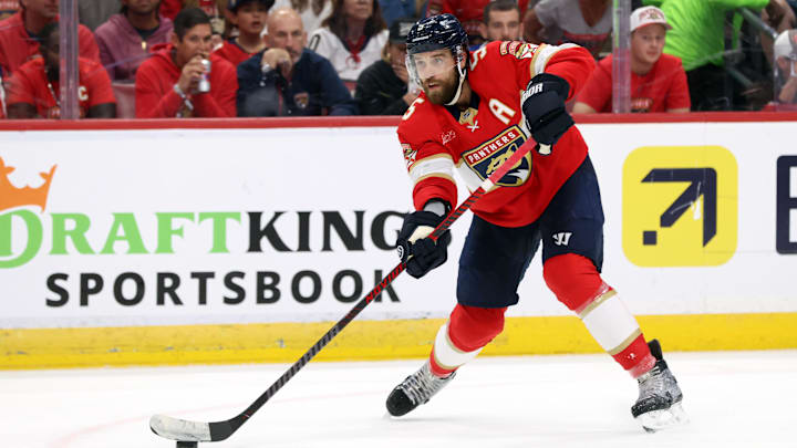 May 11, 2025; Sunrise, Florida, USA; Florida Panthers defenseman Aaron Ekblad (5) passes the puck against the Toronto Maple Leafs during the second period in game four of the second round of the 2025 Stanley Cup Playoffs at Amerant Bank Arena. Mandatory Credit: Kim Klement Neitzel-Imagn Images