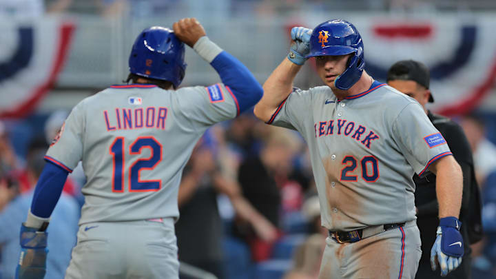 Apr 2, 2025; Miami, Florida, USA; New York Mets first baseman Pete Alonso (20) celebrates with shortstop Francisco Lindor (12) after hitting a three-run home run against the Miami Marlins during the eighth inning at loanDepot Park. Mandatory Credit: Sam Navarro-Imagn Images
