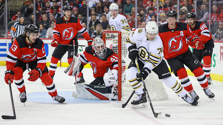 Dec 13, 2023; Newark, New Jersey, USA; Boston Bruins left wing Jake DeBrusk (74) plays the puck in