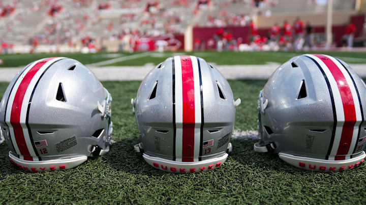 Sep 2, 2023; Bloomington, Indiana, USA; Ohio State Buckeyes helmets sit on the sideline prior to the NCAA football game at Indiana University Memorial Stadium.