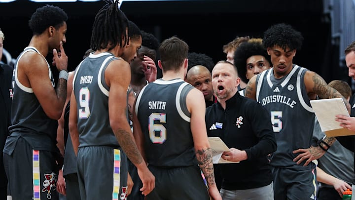 Louisville basketball coach Pat Kelsey instructs his team during a timeout against Wake Forest in their game at the KFC Yum! Center 