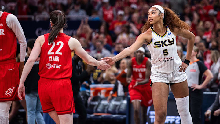 May 17, 2025; Indianapolis, Indiana, USA; Indiana Fever guard Caitlin Clark (22) and Chicago Sky forward Angel Reese (5) shake hands before the game at Gainbridge Fieldhouse. Mandatory Credit: Trevor Ruszkowski-Imagn Images