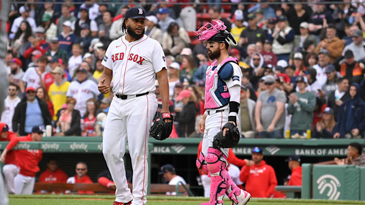 May 12, 2024; Boston, Massachusetts, USA;  Boston Red Sox catcher Connor Wong (12) and  pitcher Kenley Jansen (74) wait for a replay review during the ninth inning against the Washington Nationals at Fenway Park. Mandatory Credit: Eric Canha-USA TODAY Sports