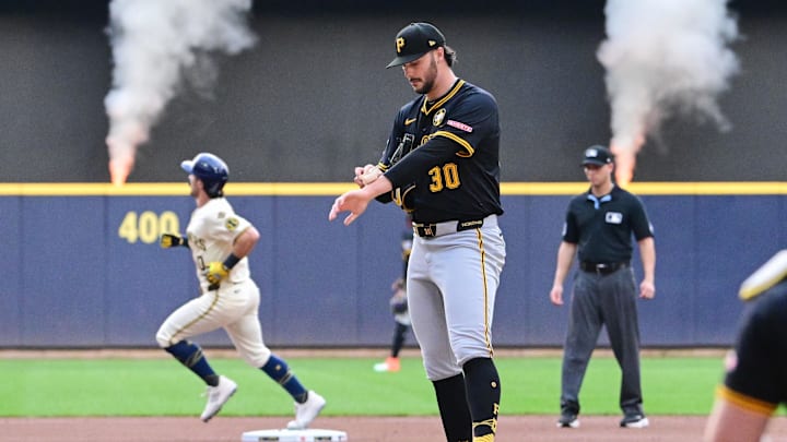 Aug 12, 2025; Milwaukee, Wisconsin, USA;  Pittsburgh Pirates starting pitcher Paul Skenes (30) reacts after giving up a solo home run to Milwaukee Brewers right fielder Sal Frelick (10) in the first inning at American Family Field. Mandatory Credit: Benny Sieu-Imagn Images