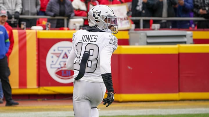 Dec 25, 2023; Kansas City, Missouri, USA; Las Vegas Raiders cornerback Jack Jones (18) scores after intercepting against the Kansas City Chiefs during the first half at GEHA Field at Arrowhead Stadium. Mandatory Credit: Denny Medley-USA TODAY Sports