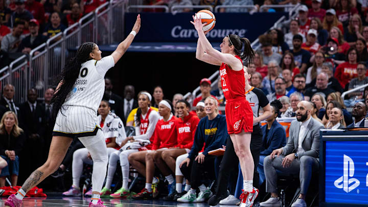 May 17, 2025; Indianapolis, Indiana, USA; Indiana Fever guard Caitlin Clark (22)  shoots the ball while Chicago Sky center Kamilla Cardoso (10) defends in the second half at Gainbridge Fieldhouse. Mandatory Credit: Trevor Ruszkowski-Imagn Images