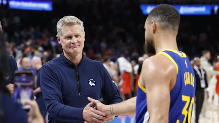 Nov 10, 2024; Oklahoma City, Oklahoma, USA; Golden State Warriors head coach Steve Kerr celebrates with guard Stephen Curry (30) after their team defeated the Oklahoma City Thunder at Paycom Center. Mandatory Credit: Alonzo Adams-Imagn Images