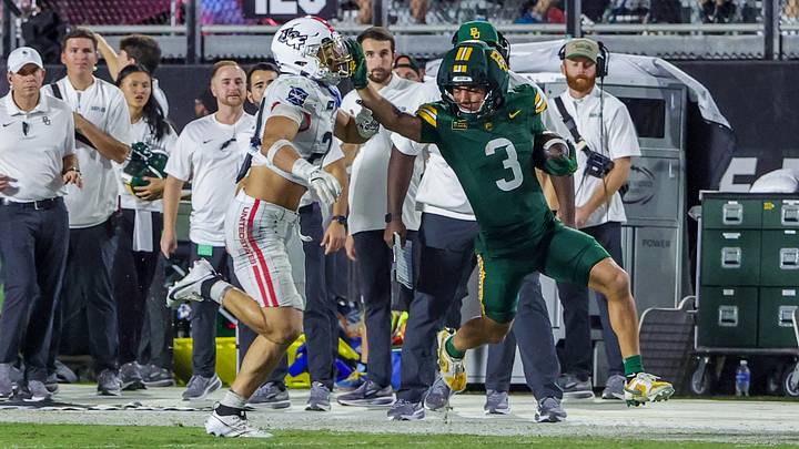 Oct 30, 2026; Orlando, Florida, USA; Baylor Bears wide receiver Jadon Porter (3) runs the ball as Central Florida Knights linebacker Tackett Curtis (24) moves in for the tackle during the second quarter at Acrisure Bounce House. Mandatory Credit: Mike Watters-Imagn Images Oct 30, 2026; Orlando, Florida, USA; Baylor Bears wide receiver Jadon Porter (3) runs the ball as Central Florida Knights linebacker Tackett Curtis (24) moves in for the tackle during the second quarter at Acrisure Bounce House. Mandatory Credit: Mike Watters-Imagn Images