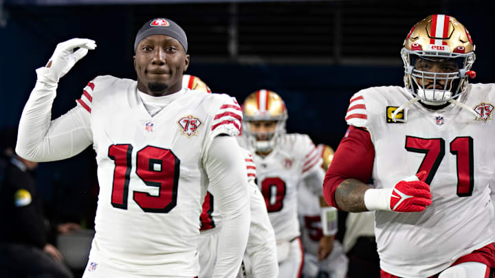 San Francisco 49ers wide receiver Deebo Samuel (L) and offensive tackle Trent Williams (R)