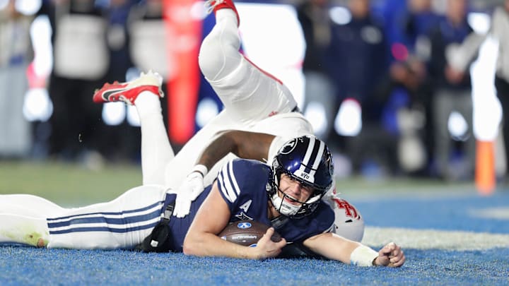 Jake Retzlaff dives across the goal line to score a touchdown against Houston.