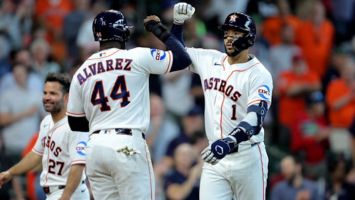  Houston Astros shortstop Carlos Correa (1) is congratulated by Houston Astros designated hitter Yordan Alvarez (44) after hitting a three-run home run to left field against the Boston Red Sox during the fifth inning at Daikin Park.