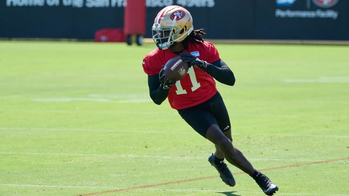 Jul 27, 2023; Santa Clara, CA, USA; San Francisco 49ers wide receiver Brandon Aiyuk (11) runs with the ball after a catch during training camp at the SAP Performance Facility. Mandatory Credit: Robert Edwards-USA TODAY Sports Jul 27, 2023; Santa Clara, CA, USA; San Francisco 49ers wide receiver Brandon Aiyuk (11) runs with the ball after a catch during training camp at the SAP Performance Facility. Mandatory Credit: Robert Edwards-USA TODAY Sports