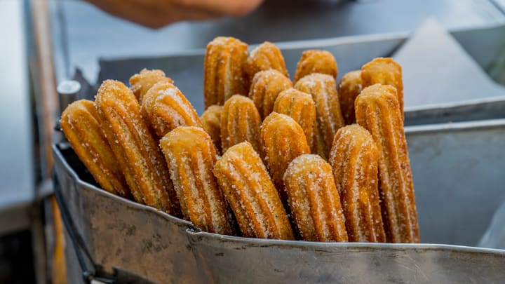 A street vendor is selling Churros in downtown Oaxaca de...