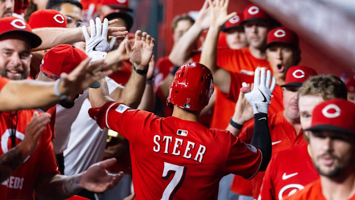 Aug 24, 2025; Phoenix, Arizona, USA; Cincinnati Reds infielder Spencer Steer celebrates with teammates in the dugout after hitting a three run home run in the eighth inning against the Arizona Diamondbacks at Chase Field. Mandatory Credit: Mark J. Rebilas-Imagn Images