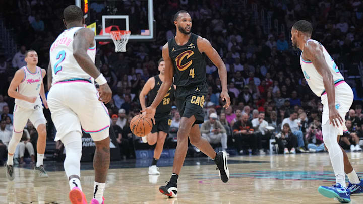 Jan 29, 2025; Miami, Florida, USA;  Cleveland Cavaliers forward Evan Mobley (4) brings the ball up the court as the Miami Heat defend during the first half at Kaseya Center. Mandatory Credit: Jim Rassol-Imagn Images