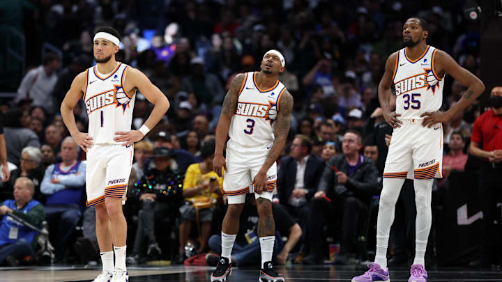 Phoenix Suns guard Devin Booker (1) and guard Bradley Beal (3) and forward Kevin Durant (35) stands on the floor during the fourth quarter against the Los Angeles Clippers at Crypto.com Arena. Mandatory Credit: Kiyoshi Mio-Imagn Images