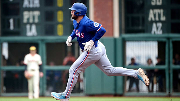 Apr 27, 2025; San Francisco, California, USA; Texas Rangers first baseman Jake Burger (21) runs toward second base with a double against the San Francisco Giants during the first inning at Oracle Park. 