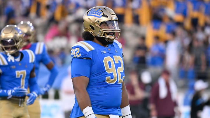 Oct 12, 2024; Pasadena, California, USA; UCLA Bruins defensive lineman Siale Taupaki (92) during the first quarter against the Minnesota Golden Gophers at Rose Bowl. Mandatory Credit: Robert Hanashiro-Imagn Images