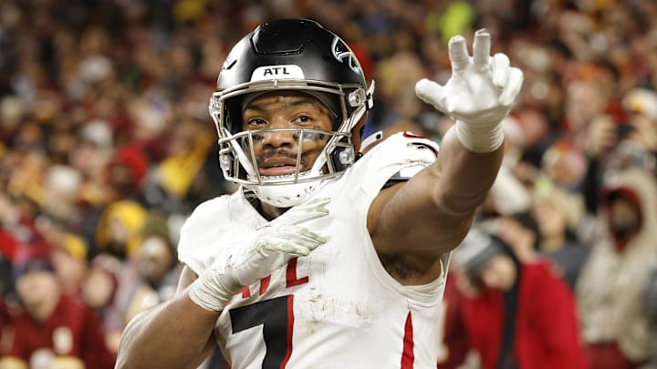 Atlanta Falcons running back Bijan Robinson (7) celebrates after scoring a touchdown against the Washington Commanders during the first half at Northwest Stadium. 