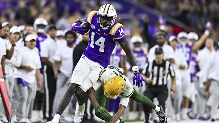 Dec 31, 2024; Houston, TX, USA; Baylor Bears cornerback Caden Jenkins (8) tackles LSU Tigers tight end Trey'Dez Green (14) during the fourth quarter at NRG Stadium. The Tigers defeat the Bears 44-31. Mandatory Credit: Maria Lysaker-Imagn Images Dec 31, 2024; Houston, TX, USA; Baylor Bears cornerback Caden Jenkins (8) tackles LSU Tigers tight end Trey'Dez Green (14) during the fourth quarter at NRG Stadium. The Tigers defeat the Bears 44-31. Mandatory Credit: Maria Lysaker-Imagn Images