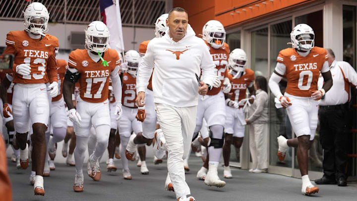 Texas Longhorns head coach Steve Sarkisian leads his team onto the field before a game against the Vanderbilt Commodores at Darrell K Royal-Texas Memorial Stadium.