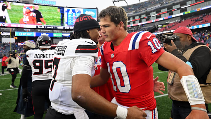 Oct 13, 2024; Foxborough, Massachusetts, USA; Houston Texans quarterback C.J. Stroud (7) hugs New England Patriots quarterback Drake Maye (10) after a game at Gillette Stadium. Mandatory Credit: Brian Fluharty-Imagn Images