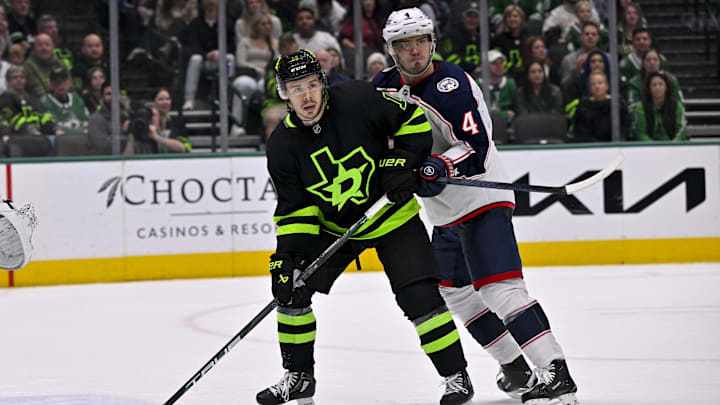 Feb 2, 2025; Dallas, Texas, USA; Dallas Stars center Logan Stankoven (11) and Columbus Blue Jackets center Cole Sillinger (4) in action during the game between the Dallas Stars and the Columbus Blue Jackets at American Airlines Center. Mandatory Credit: Jerome Miron-Imagn Images