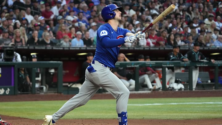Mar 29, 2025; Phoenix, Arizona, USA; Chicago Cubs outfielder Kyle Tucker (30) hits a two-run home run against the Arizona Diamondbacks in the fifth inning at Chase Field. 