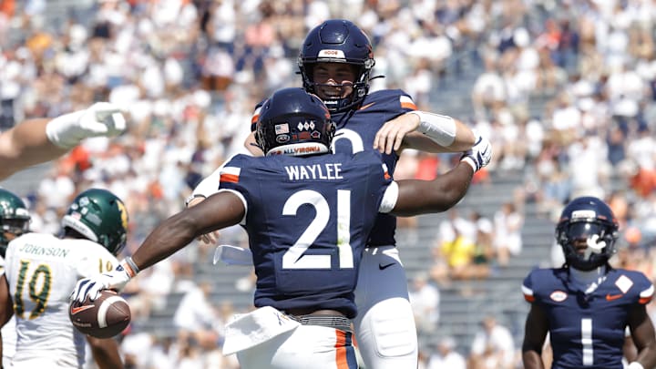 Sep 13, 2025; Charlottesville, Virginia, USA; Virginia Cavaliers running back Harrison Waylee (21) celebrates with Cavaliers defensive back Ja'Son Prevard (10) after scoring a touchdown against the William & Mary Tribe during the second quarter at Scott Stadium. Mandatory Credit: Amber Searls-Imagn Images