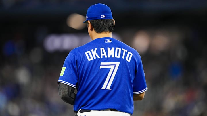 View of the back of Toronto Blue Jays third baseman Kazuma Okamoto's (7) jersey. 